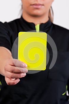 Soccer referee showing the yellow card