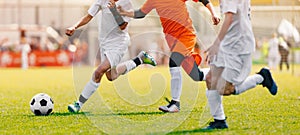 Soccer Shot. Young Boys Kicking Football Soccer Tournament Match on the Grass Pitch. Football Players Duel