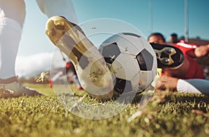 Soccer, soccer ball and man slide tackle during match, training or competition outdoors. Football, sports and football