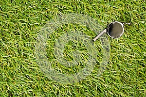 Soccer sports chrome whistle on grass background - penalty, foul or sports concept, top view flat lay from above