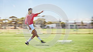 Soccer, sports and fitness with a man athlete playing a game or match on a grass pitch outdoor in summer. Football