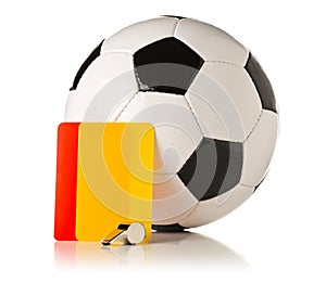 Soccer sports referee yellow and red cards with soccer ball and referee whistle on white background photo
