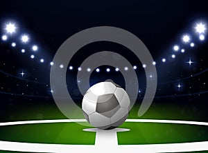 Soccer stadium with ball and spotlight at night