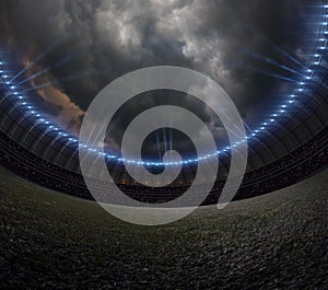 Soccer stadium with illumination, green grass night sky