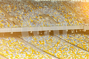 Soccer stadium inside view. football field, empty stands, a crowd of fans, a roof against the sky