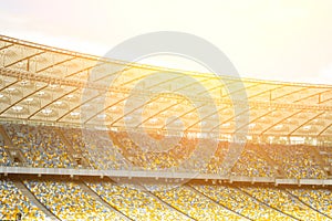 soccer stadium inside view. football field, empty stands, a crowd of fans, a roof against the sky