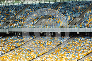 soccer stadium inside view. football field, empty stands, a crowd of fans, a roof against the sky