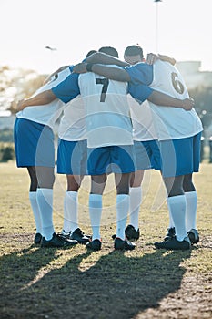 Soccer, support or team in a huddle for motivation, goals or group mission on a field for a sports game. Unity, stadium