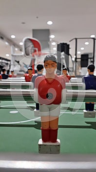 Soccer table game caracter on red jersey photo