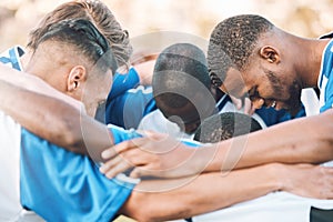 Soccer, team motivation and men huddle at sports competition or game for teamwork on a field. Football group people