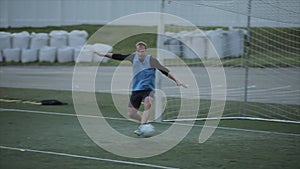 Soccer team`s game training. The goalkeeper misses the ball into the net. The moment of the goal. Slow motion. Close-up