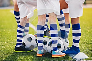 Soccer Team on Training. Legs of Group of Young Football Players on Training Field on Summer Day