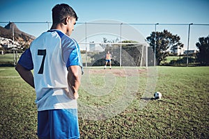 Soccer, thinking and a man on a field for a goal, sports penalty or training for a team. Fitness, focus and an athlete