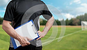 Soccer Trainer on a Soccer Field