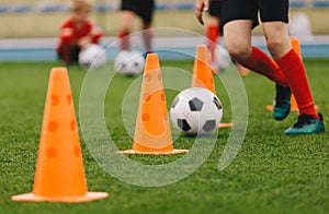 Soccer Training Drill. Football Player Running With Ball. Soccer Athletes Participate in Soccer Practice Drills