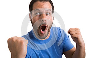 Soccerball fan with blue shirt celebrating the success of his team