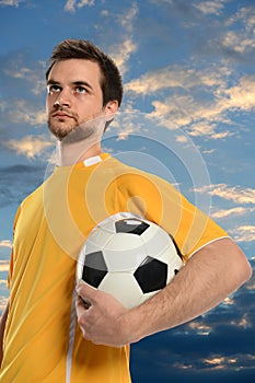 Socer Player Holding Ball