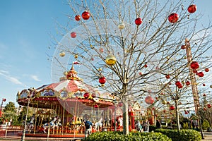 Sochi, Russia - January 02 2022: Colorful Carousel Attraction Ride With Wooden Horses. Children's carousel of