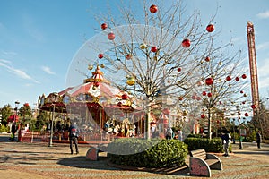 Sochi, Russia - January 02 2022: Colorful Carousel Attraction Ride With Wooden Horses. Children's carousel of