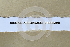 social assistance programs on white paper