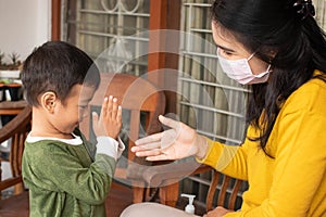 Social distance. Asian boys refuse to shake hands