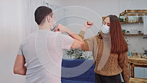 Social distance. Two businessmen touch elbows. Bump avoid greeting. Pandemic concept. Man and woman meeting greet each