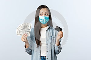 Social distancing lifestyle, covid-19 pandemic business and employement concept. Asian girl in medical mask make