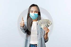 Social distancing lifestyle, covid-19 pandemic business and employement concept. Satisfied cute asian female in medical