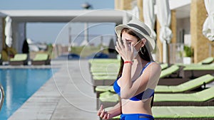Social distancing, young female tourist takes precautions and wears medical mask to protect against virus and infection