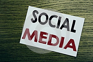 Social Media. Business concept for Community Social Media written on sticky note, wooden wood background with copy space.