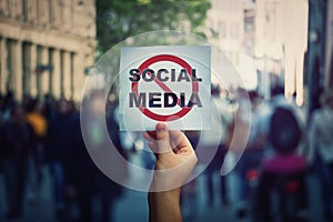 Social media censorship, political war between US president banning social networks. Hand holding a banner with forbidden sign