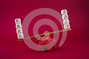 Social media concept. Corona virus fake news concept. Scale on red background