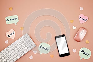 Social media concept flatlay with keyboard, phone, mouse