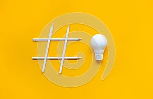 Social media and creativity concepts with Hashtag sign made of pencil and lightbulb