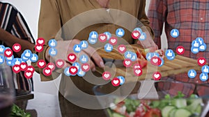 Social media icons floating against mid section of caucasian senior woman chopping vegetables