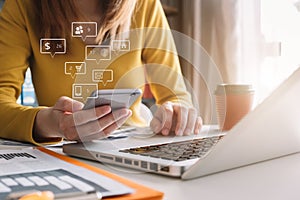 Social media and Marketing virtual icons screen of business women typing keyboard with laptop computer and smart phone.