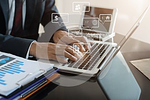 Social media and Marketing virtual icons screen of business women typing keyboard with laptop computer and tablet at office