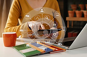 Social media and Marketing virtual icons screen of business women typing keyboard with laptop computer and tablet at office