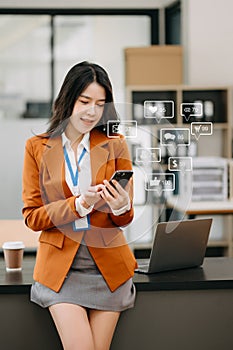 Social media and Marketing virtual icons screen concept. businesswoman typing keyboard tablet with laptop computer and smart