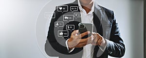Social media and Marketing virtual icons screen concept.close up of businessman typing keyboard tablet with laptop computer and