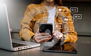 Social media and Marketing virtual icons screen concept.close up of businesswoman typing keyboard tablet with laptop computer and