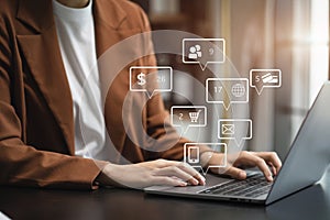 Social media and Marketing virtual icons screen of woman typing keyboard with laptop computer at office at morning light