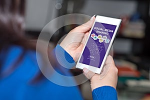 Social media sharing concept on a smartphone