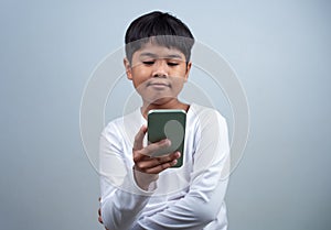 Social media and technology concepts. Boy hands holding a smartphone and stylus pencil to use multimedia and social media to