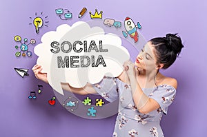 Social Media with woman holding a speech bubble