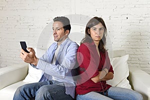 Social network addict man using mobile phone ignoring wife or girlfriend upset and angry