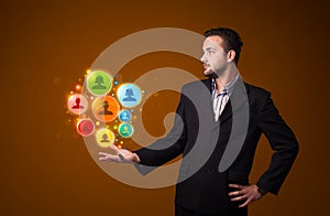 Social network icons in the hand of a businessman