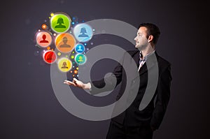 Social network icons in the hand of a businessman