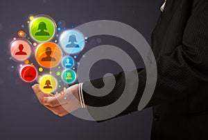 Social network icons in the hand of a businessman