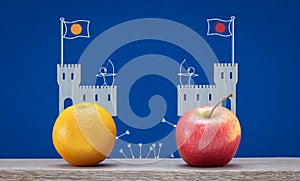social and political polarisation, tribalism, division concept, apple and orange ideology at castles fighting photo